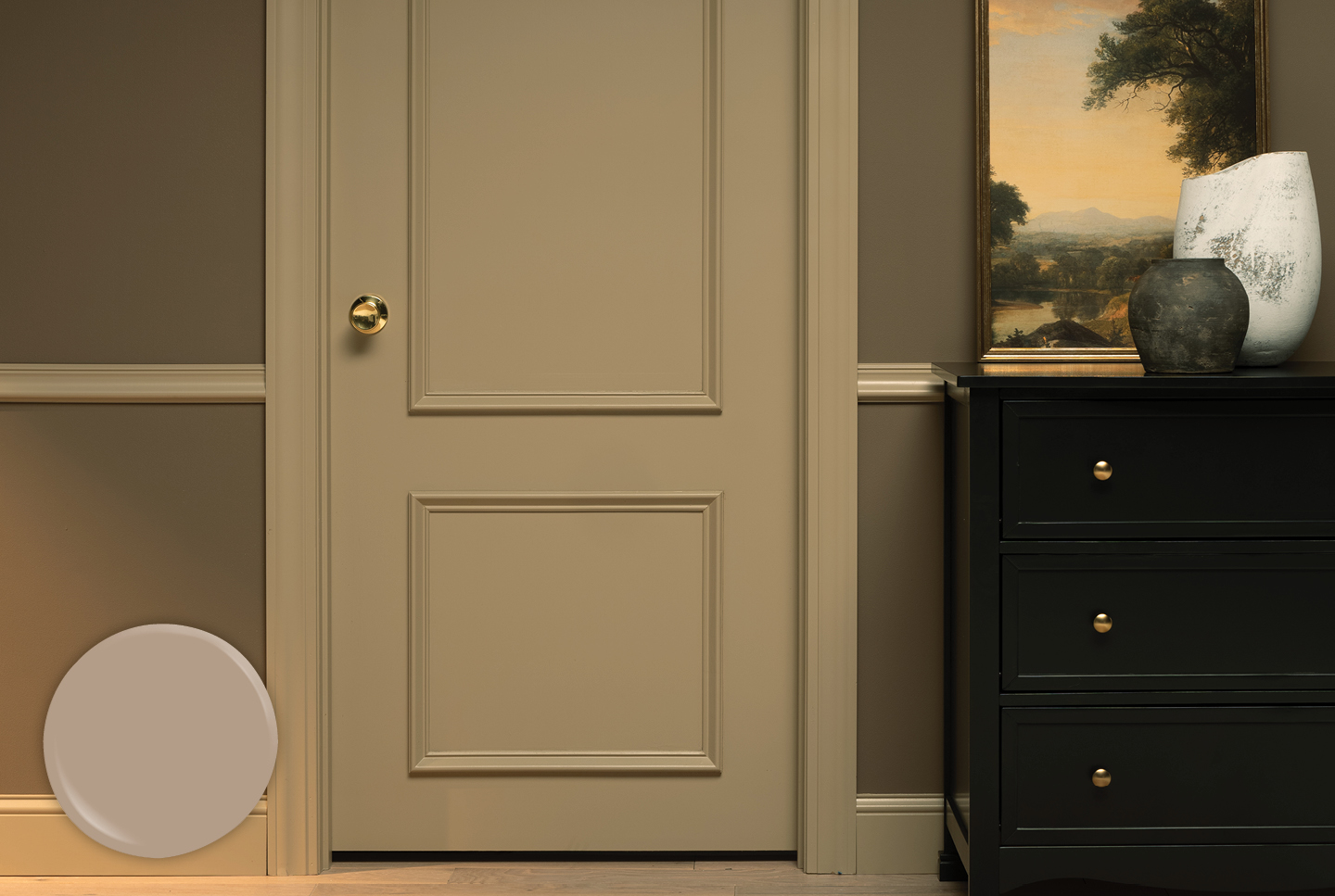 Paneled bedroom door in Faint Maple, with gold doorknob. Oil painting sits on dark wood dresser to the right of the door. 